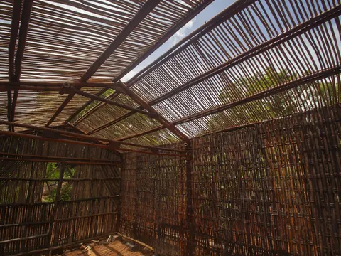 Looking up into a roof frame of lashed bamboo