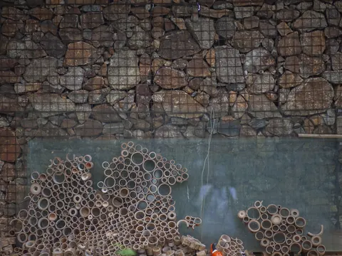 A stone and bamboo wall built as a home for solitary bees
